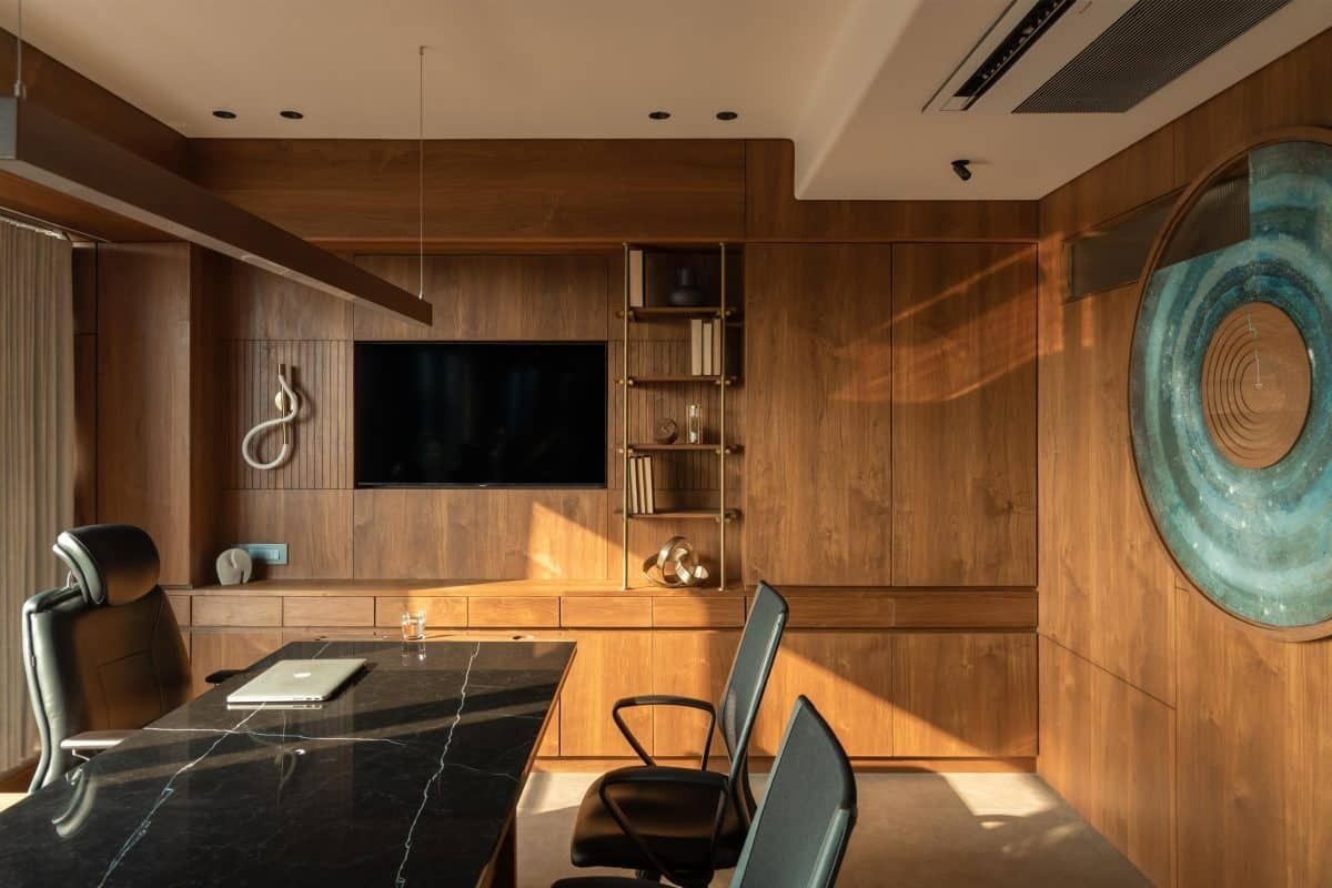 Warm wood-panelled executive office cabin with marble desk